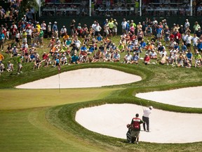 Fred Couples hits from a bunker onto the 14th green during the third round of the 2013 U.S. Senior Open Championship at Omaha Country Club in Omaha, Nebraska.  QMI Agency