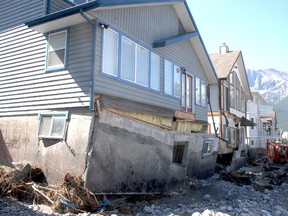 Homeowners with heavily damaged homes along Cougar Creek in Canmore are getting a tax break from local government. File photo