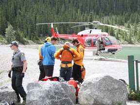 Kananaskis Public Safety rescue workers clean up after extracting an injured climber off Hal Ling Peak south of Canmore on Sunday, July 14, 2013. Russ Ullyot/ Crag & Canyon/ QMI Agency