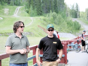 24 Hours of Adrenalin CEO Stuart Dorland, left, and Matt Hadley, Canmore Nordic Centre trail crews manager, took time to address and thank the hard work done by Friends of Kananaskis volunteers to prepare the trails for the upcoming Adrenalin event on Sunday, July 14, 2013. Russ Ullyot/ Crag & Canyon/ QMI Agency