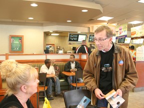 Mike Allen chats with Tim Hortons customers during the provincial election campaign in May 2012. VINCENT MCDERMOTT/TODAY FILE PHOTO