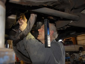 Perfection Automotive Services mechanic Allan McRae performs some maintenance on a 4x4 truck for one of the business’s clients. Performing regular maintenance, most mechanics will tell you, is one way to keep your vehicle running smoothly and save you money at the gas pumps. (Jocelyn TUrner/Daily Herald-Tribune)