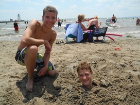 Shane Haalstra of Brantford found an interesting way to help Eric Bouwmeester of Lynden keep cool on the beach in Port Dover last year. (SARAH DOKTOR Simcoe Reformer File Photo)