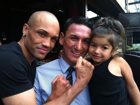 Mike Walchuk (left) and Junior Moar (middle) pose with Moar's three-year old daugher Miller on Wednesday at the downtown Pony Corral. Walchuk and Moar will fight for the Canadian light heavyweight championship in Winnipeg on Oct. 12.