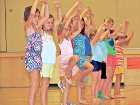Girls show off their dance moves after a week-long Dance and Art Camp at Inglenook Studio.
MARNEY BLUNT/FOR THE ENTERPRISE