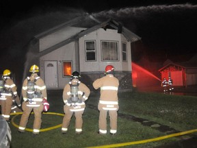 The Grande Prairie fire department responded to an early morning house fire on Thursday, July 18, 2013. The house, located 9601 90A Street in the Cobblestone area, was fully engulfed. Everyone in the home got out safely. A total of 13 firefighters fought the blaze and Platoon Chief Tony Lutzmann speculated that the fire began on the exterior of the house, but that is not yet confirmed. An investigation is underway to determine the cause. KIRSTEN GORUK/DAILY HERALD-TRIBUNE