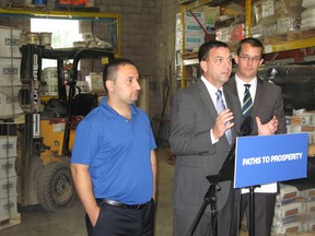 Conservative candidate Ali Chahbar, leader Tim Hudak and MPP Monte McNaughton advocating their plan to bring manufacturing jobs to Ontario. (BRENT BOLES, The London Free Press)