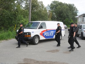 Greater Sudbury Police and OPP officers search for Ryan Gaulin on June 21, 2012, after he kidnapped and robbed a senior in North Bay. (File photo)