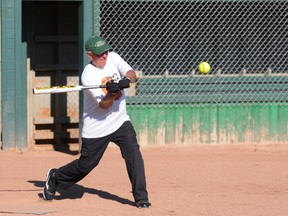 Grande Prairie 65+ slo-pitch player Ray Gilkyson swings at the ball during a match against the 55+ team Tuesday evening. The teams were preparing for the 2013 Alberta 55 Plus Summer Games, which will be held in Barrhead and Westlock from July 25-28. (Aaron Hinks/Daily Herald-Tribune)