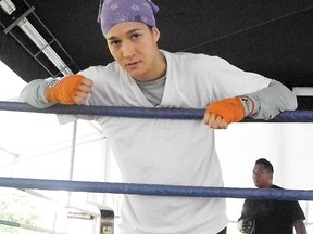 Lita Mae Button takes a break from a workout on Thursday, in preparation for her second bout at the Golden Gloves Championships. The fight will be an exhibition. Button won the 64 kilos women’s elite title in her first match.