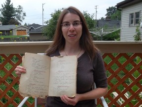 Tracy Falbe holds a handwritten recipe book by her grandmother, Edna Oldershaw Irwin, from 1926 that was found in a closet. Falbe has restored 64 recipes to create 'My Grandma's Vintage Recipes: Old Standards for a New Age.'  CONTRIBUTED/ THE CHATHAM DAILY NEWS/ QMI AGENCY