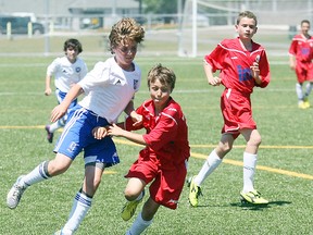 The North Bay Selects FC eked out a 1-1 tie with the North York Spartacus 2000 Saturday during Central Soccer League under-13 Level 4 premier division play at Steve Omischl Sports Field Complex as North Bay’s Matteo Pavone, left, chases down a loose ball.