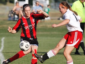 Bay of Quinte Women's Soccer League action (2-2) between Y'Wanna Have a Cafe/Quinte Old Boys (red and black jersey) and Quinte Cosmos (white jersey) at Zwicks Park in Belleville, Ont. Thursday, July 18, 2013. JEROME LESSARD/The Intelligencer/QMI Agency