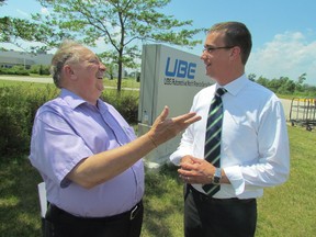 Sarnia-Lambton MPP Bob Bailey, left, speaks with Lambton-Kent-Middlesex MPP Monte McNaughton Friday outside the former Ube automotive plant in Sarnia. They were releasing an Ontario PC plan they said will create 300,000 manufacturing jobs, if their party is elected. The Ube plant has sat vacant since it closed several years ago. PAUL MORDEN/THE OBSERVER/QMI AGENCY