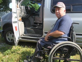 Dale Waybrant, 57, shows off his new accessible van at his Courtright, Ont. home Friday, July 19, 2013. He recently learned he will have to do his driver's test again after purchasing the van, despite holding a clean driving record. (BARBARA SIMPSON, The Observer)