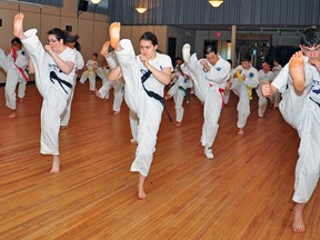 From left to right, Kimberly, Kyra and Liam Droog are all black belt holders in taekwondo. The family of four (father John not pictured) decided to try martial arts as a way to spend more time together. (Omar Mosleh/La Nouvelle Beaumont News)