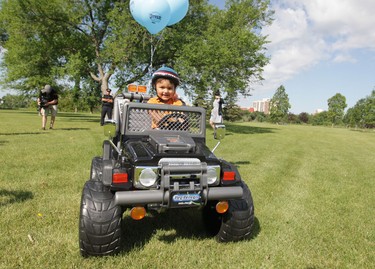 Three-year-old Isaiah suffers from leukemia. On July 19, 2013, he was presented with a toy Jeep, courtesy of The Dream Factory. (Winnipeg Sun)