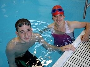 Kingston Y Penguins members Chris Tsonsos and Cassidy pause during a training session at the Kingston Family YMCA pool this week.
Ian MacAlpine The Whig-Standard