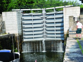 A pleasure boat moves into the middle lock of the Jones Falls lock station on the Rideau Canal system in June (Recorder and Times file photo).