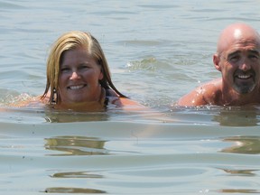 Distance swimmers Lisa Anderson and Chris Peters have called off this weekend's 30-kilometre crossing attempt from Long Point to  Port Dover. A new date will be set for the swim. The pair is doing the swim in support of Canadian Tire’s Jump Start program for young athletes.  (MONTE SONNENBERG Simcoe Reformer)