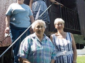 Tracey Turner, curator of the Fort la Reine Museum, stands at the top of the stairs leading into the Superintendants Car - Car 21 at the museum. With her are Elaine Kairns, Evelyn Smith and Judy Nagribiank from Kozy Korner. The organization donated $5,000 to the museum’s capital campaign designated to support infrastructure improvements to build a roof structure over car. The money will also provide maintenance upgrades and restoration to the car itself. Once these upgrades are in place, the car will be re-opened to the public. Turner noted the 110-year old car is one of two in the world and is the oldest. Only 22 were ever made. (Svjetlana Mlinarevic/Portage Daily Graphic)