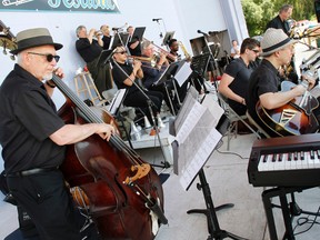 Members of Ross Wooldridge and The Galaxy Orchestra play 'Benny Meets Artie', a tribute to Artie Shaw and Benny Goodman at the second annual Trenton Big Band Festival at the Amphitheatre in Centennial Park in Trenton, Ont. Sunday, July 21, 2013. JEROME LESSARD/The Intelligencer/QMI Agency