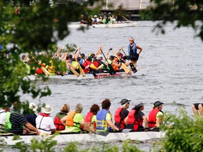 Local Dragon Boat crews warm up on the Trent River along the Trenton Rowing and Paddling Club at Kiwanis Park in Trenton, Ont. as the club officially opened it's boathouse headquarters Saturday morning, July 20 2013. JEROME LESSARD/The Intelligencer/QMI Agency