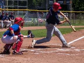 Kingston Ponies' Jeff Skelhorne-Gross makes contact with the pitch during action Sunday against the Capital City Cubs at Megaffin Park. (Sam Koebrich For The Whig-Standard).