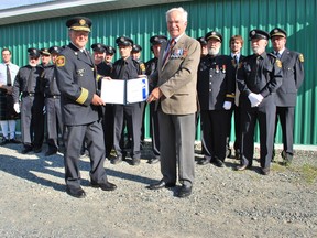 Lieutenant General (ret.) James Gervais, a Kenogami summer resident, recently presented Kenogami Fire Chief Badge Darling with the Governor General’s Caring Canadian award in recognition of his contributions to his community.