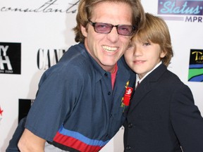 Reality TV star David 'Puck' Rainey with his son, Bogart Rainey. (WENN.COM file photo)