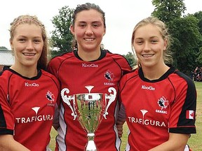 Sara Svoboda, Cindy Nelles and Katie Svoboda — all of Belleville — with the Nations Cup in Nottingham, England.