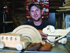 Jamin George creates wood toys and furniture in the workshop behind his Drayton Ave. home.
