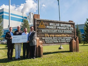 Dale Holloway operations manager, Mayor Trevor Thain, MLA George VanderBurg and Mark Wright, engineering and maintenance manager, complete the third phase of the Alberta Government EcoTrust Grant agreement with Millar Western. 
Christopher King | Whitecourt Star