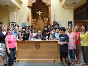 Students from Belleville's sister city, Gunpo, and representatives from the Hastings and Prince Edward District School Board get their photo taken with Mayor Neil Ellis Monday afternoon during a visit to city hall in Belleville.