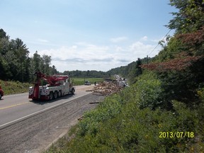 Tractor trailer carrying logs has closed section of Hwy 17 W past Webbwood