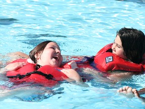 Wearing a life-jacket is among the most important thing swimmers of all ages can do when in the water. This is among the key messages being promoted during Drowning Prevention Week July 20-27. A Swim to Survive Challenge will be taking place at Splash Island on July 24 from 7-9 p.m. as part of the safety week. (FILE PHOTO)