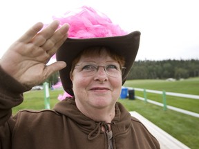 Trail boss Jane Hurl, from Lamont, Alberta, wore a bright pink hat during the Wild Pink Yonder Trails End Celebration held at Whitemud Equine Centre in Edmonton, last September. The event, which includes a cross-prairie horse ride, raises funds for breast cancer research and will run in the Peace Country this year starting Aug. 10 in Hythe. (Ian Kucerak/QMI Agency)