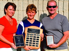 This year's Doug Scott Memorial Award recipient, Dawson Mallette, is pictured with Scott's parents, Doug Scott Sr. and Marla Scott. (STEVE PETTIBONE The Recorder and Times)