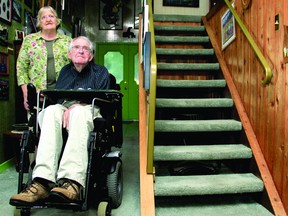 Elaine McClintock, left, and her husband John McClintock sit in their Brockville home Monday evening. The McClintocks will be awarded the 2013 Accessibility Award at council for their work though the organization ‘Education on Quality Accessibility’. (THOMAS LEE/The Recorder and Times)