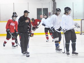 Coach Rick Kowalsky (in black) leads a group of young hockey players through a warm up skate during his Elite Ice Conditioning camp at the Simcoe Rec Centre in this file photo from 2013. (EDDIE CHAU Simcoe Reformer)