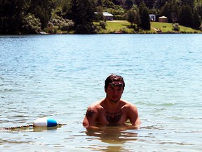 Alex Buehlow of Bright, Ont. will look to become the youngest male to swim across Lake Ontario Aug. 12 and aim to finish the crossing in under the 13 hour and 49 minute record. The 18-year-old, who swims with the Wilmot Aces, is helping to raise money for the Three to Be charity that supports research into neurological disorders that afflict children. (GREG COLGAN/QMI Agency/Sentinel-Review)