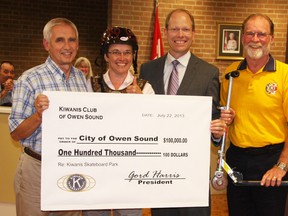 Kiwanis Club president Gord Harris, right, and club member Paul Kirk, left, pose with Mayor Deb Haswell and Coun. Jim McManaman at Monday’s night’s council meeting.