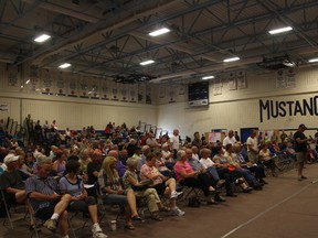 KEVIN RUSHWORTH HIGH RIVER TIMES/QMI AGENCY. A flood-mapping information session on July 18 heated up between residents and the panelists, with residents saying they've been kept in the dark without new flood maps.