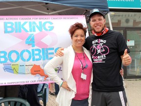 Managing director of the Lake of the Woods Hospital Foundation Jess Rheault (left) and Biking 4 Boobies cyclist Kyle Chevalier at the Biking 4 Boobies barbecue at Standard Insurance on Monday.
MARNEY BLUNT/DAILY MINER AND NEWS