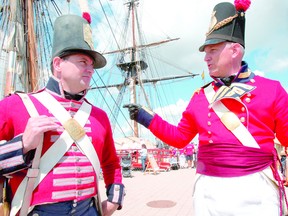 Royal Newfoundland Regiment re-enactors Colin Brown and Dave Brunelle stand in front of American tall ships at the Roberta Bondar Pavilion on the weekend. The waterfront was a busy place with the Tall Ships, Rotaryfest and war of 1812 re-enactors all taking place by the St. Marys River, a nationally historic waterway.