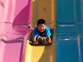 A youngster comes head first down the super slide at the Melfort Exhibition on  Saturday, July 20.