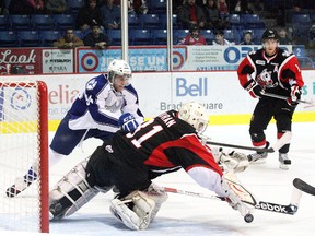 Brody Silk, of the Sudbury Wolves, slides the puck past Brent Moran, of the Niagara IceDogs, during OHL action at the Sudbury Community Arena in October of 2012. After being passed over in the 2013 NHL Entry Draft, Silk attended a development camp with the Detroit Red Wings earlier this month and will be part of the Boston Bruins' entry in a pre-season rookie tournament, held in Coral Springs, Fla., in early September.
