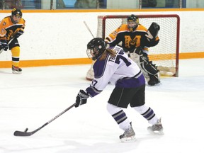 Maddie Trudeau concentrates on the puck right before whipping it into the top corner of the net during a game for the Beaver Brae Broncos. Trudeau was one of 12 girls given a bursary from Lake of the Woods Girls Hockey for post-secondary education. 
FILE PHOTO/Daily Miner and News