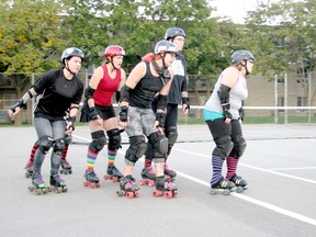 The Crow City Roller Girls practice on the tennis court at Trillium Village in Chatham in this 2012 file photo. The team is currently seeking new players, as well as officials.