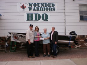 (Left to right) Wounded Warriors Weekend Director Blake Emmons, Diamond North Credit Union Marketing Officer Rebecca Peters, Wounded Warriors Weekend Director Verda Hoppe and Diamond North Credit Union Human Resources Manager Cris Richer.  Diamond North Marketing Officer, Rebecca Peters presents the $10,000 cheque to Wounded Warriors Weekend Director, Verda Hoppe at the WWW headquarters.